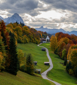 Kirchdorf Wamberg with St. Anna's Church above Garmisch-Partenkirchen in autumn, Bauernstadel, promenade, trees, clouds, Garmisch-Partenkirchen, Upper Bavaria, Bavaria, southern Germany, Germany Kirchdorf Wamberg with St. Anna's Church above Garmisch-Partenkirchen in autumn, Bauernstadel, promenade, trees, clouds, Garmisch-Partenkirchen, Upper Bavaria, Bavaria, southern Germany, Germany
