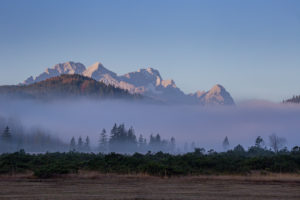 Clouds of fog on the Barmsee against Wetterstein Mountains with Alpspitze, Zugspitze and Waxenstones, autumn, trees, blue sky, Krün, Garmisch-Partenkirchen, Upper Bavaria, Bavaria, southern Germany, Germany Clouds of fog on the Barmsee against Wetterstein Mountains with Alpspitze, Zugspitze and Waxenstones, autumn, trees, blue sky, Krün, Garmisch-Partenkirchen, Upper Bavaria, Bavaria, southern Germany, Germany