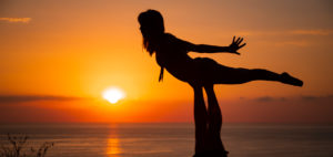 Young woman, acrobatics, sunset, sun, silhouette, sea Young woman, acrobatics, sunset, sun, silhouette, sea