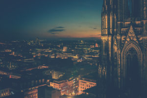The Cologne Cathedral, close-up of the towers and view over Cologne at the Blue Hour