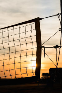 Beach volleyball - a backlit net at sunset Beach volleyball - a backlit net at sunset