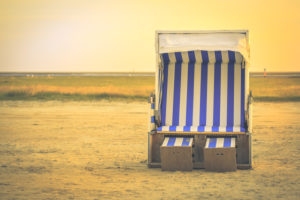 A beach chair by the North Sea - relaxation in the Wadden Sea A beach chair by the North Sea - relaxation in the Wadden Sea