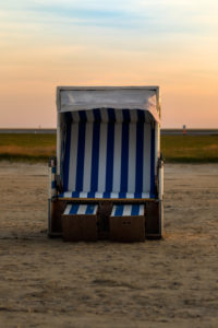 A beach chair by the North Sea - relaxation in the Wadden Sea A beach chair by the North Sea - relaxation in the Wadden Sea
