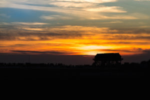 Colorful sunset on the North Sea - in the backlight of the sun a typical stilt house, pile dwellings, pile dwellings that defy the tides. Colorful sunset on the North Sea - in the backlight of the sun a typical stilt house, pile dwellings, pile dwellings that defy the tides.
