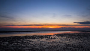 Relaxation on the Wadden Sea and on the beach of St. Peter Ording, North Sea at sunset. Relaxation on the Wadden Sea and on the beach of St. Peter Ording, North Sea at sunset.