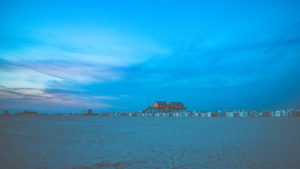 Colorful sunset on the North Sea - in the backlight of the sun a typical stilt house, pile dwellings, pile dwellings that defy the tides. Colorful sunset on the North Sea - in the backlight of the sun a typical stilt house, pile dwellings, pile dwellings that defy the tides.