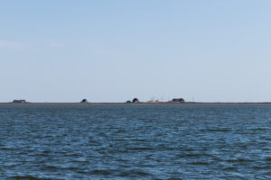Solitude and tides - houses and wind turbines in the Wadden Sea Solitude and tides - houses and wind turbines in the Wadden Sea