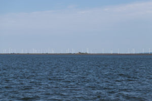 Solitude and tides - houses and wind turbines in the Wadden Sea Solitude and tides - houses and wind turbines in the Wadden Sea