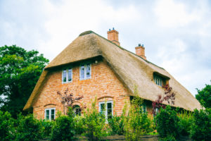 A thatched roof of a clinker brick house on Sylt.