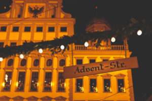 The Augsburger Christkindlesmarkt, Christmas market in Swabia at night. Sign saying Advent-Str.