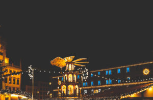 The pyramid of lights, Christmas pyramid at the Augsburg Christkindlesmarkt, Christmas market in Swabia at night.