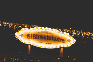 A sign on a Christmas market, Christkindlesmarkt that reads mulled wine hut