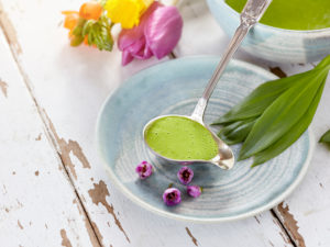 Ayurvedic cuisine - wild garlic sauce in a silver ladle