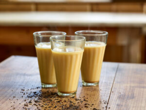 ayurvedic cuisine, three glasses of Golden Chai tea with milk or oat milk