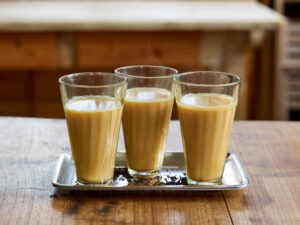 ayurvedic cuisine, three glasses of Golden Chai tea with milk or oat milk