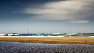 Empty beach and lighthouse in Port la Nouvelle in summer. Empty beach and lighthouse in Port la Nouvelle in summer.