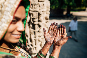 A woman shows us her henna painting at the solar temple in Modhera, India A woman shows us her henna painting at the solar temple in Modhera, India