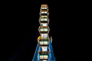 Long time exposure at night at the Oktoberfest, fairground rides Long time exposure at night at the Oktoberfest, fairground rides