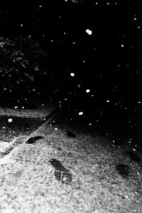 Snowflakes and footprints at night Snowflakes and footprints at night