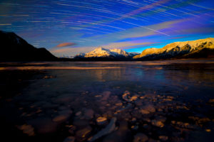 Canada, Alberta, Abraham Lake, Elliot Peak, Night, Star Trails, Bubbles in the Ice Canada, Alberta, Abraham Lake, Elliot Peak, Night, Star Trails, Bubbles in the Ice