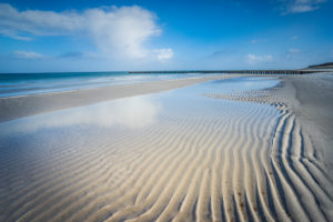 Baltic Sea at evening light, wave pattern on the beach Baltic Sea at evening light, wave pattern on the beach