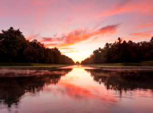 Germany, Bavaria, view from the middle channel to the Nymphenburg Palace at sunrise Germany, Bavaria, view from the middle channel to the Nymphenburg Palace at sunrise