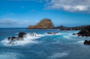 Atlantic Ocean at Porto Moniz with rock island Ilhéu Mole, Madeira, Portugal Atlantic Ocean at Porto Moniz with rock island Ilhéu Mole, Madeira, Portugal