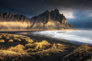 Vestrahorn mountains behind black beach in morning light, Iceland. Vestrahorn mountains behind black beach in morning light, Iceland.