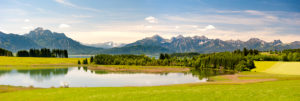 Panorama landscape in the Allgäu near Füssen with mountain range of the Alps Panorama landscape in the Allgäu near Füssen with mountain range of the Alps