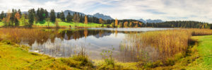 Panorama scenery in the Allgäu with Hegratsrieder See (lake) and reflextion of the mountains Panorama scenery in the Allgäu with Hegratsrieder See (lake) and reflextion of the mountains