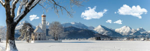 Panorama winter landscape in the Allgäu in Bavaria near Füssen with pilgrimage church Saint Coloman Panorama winter landscape in the Allgäu in Bavaria near Füssen with pilgrimage church Saint Coloman