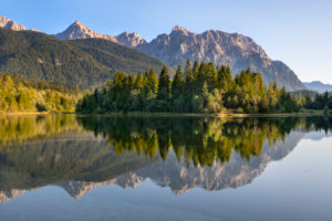 Karwendelgebirge with reflection in the Isar Reservoir near Krün Karwendelgebirge with reflection in the Isar Reservoir near Krün