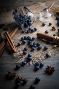 Blueberries and cinnamon sticks on jute cloth Blueberries and cinnamon sticks on jute cloth