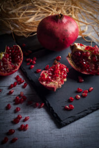 Pomegranate on slate plate Pomegranate on slate plate