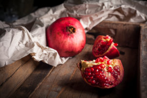 Pomegranate in wooden box Pomegranate in wooden box
