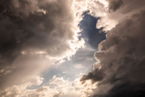 Cloudy mood with sunbeams during a gathering storm Cloudy mood with sunbeams during a gathering storm