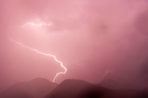 Lightning strike during a strong summer thunderstorm in the Wildsteinkopf near Mittenwald in the Bavarian Alps, with the Wetterstein in the background Lightning strike during a strong summer thunderstorm in the Wildsteinkopf near Mittenwald in the Bavarian Alps, with the Wetterstein in the background