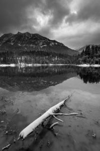 Winter at the Krün reservoir in the early morning, with clouds and snow Winter at the Krün reservoir in the early morning, with clouds and snow