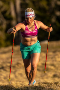 Concentrated trail runner with a natural figure while mountain running on Simetsberg on spring meadow Concentrated trail runner with a natural figure while mountain running on Simetsberg on spring meadow