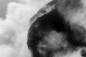 Rock slopes in the fog. The edges and flanks of the Gamsjoch in the Karwendel above the large Ahornboden in the Eng/Risstal in Tyrol. Hard mountain schemes in the mountains of the Alps in black and white