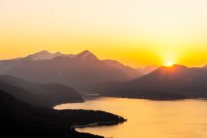 Sunset with orange evening sky over the Walchensee, in the background the Simetsberg, the Estergebirge.