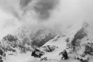 Bad weather with snow and dense clouds with fog at the Alpspitze above Garmisch-Partenkirchen. Seen from Krün.