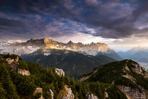 View from the Signalkopf over the Lausberg to the Karwendel mountains in the evening with a beautiful cloudy atmosphere