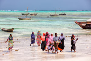 Locals having evening walk along south beaches of Zanzibar, Locals having evening walk along south beaches of Zanzibar,