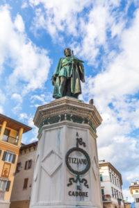 Pieve di Cadore, the main square with the bronze statue of Tiziano Vecellio, Dolomites, Belluno, Veneto, Italy Pieve di Cadore, the main square with the bronze statue of Tiziano Vecellio, Dolomites, Belluno, Veneto, Italy
