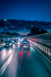evening traffic of cars in the city, alpini bridge, belluno, veneto, italy evening traffic of cars in the city, alpini bridge, belluno, veneto, italy
