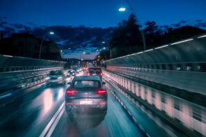 evening traffic of cars in the city, alpini bridge, belluno, veneto, italy evening traffic of cars in the city, alpini bridge, belluno, veneto, italy