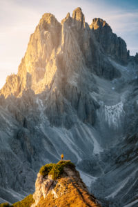 Hiker standing in front of the sharp peaks of Cadini di Misurina, Dolomites, Auronzo di Cadore, Belluno, Veneto, Italy
