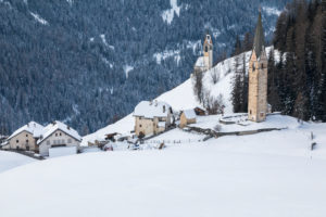 Alpine village of Tolpei with the St. Barbara chapel in winter, La Valle - Wengen, Val Badia, Bolzano, Dolomites, South Tyrol, Italy