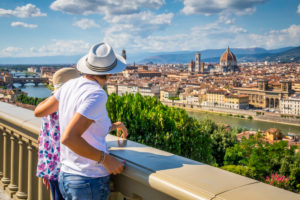 two tourists (mother and daughter) are admiring the historic center of Florence, elevated view from the panoramic point of piazzale michelangelo, Florence, Tuscany, Italy, Europe two tourists (mother and daughter) are admiring the historic center of Florence, elevated view from the panoramic point of piazzale michelangelo, Florence, Tuscany, Italy, Europe